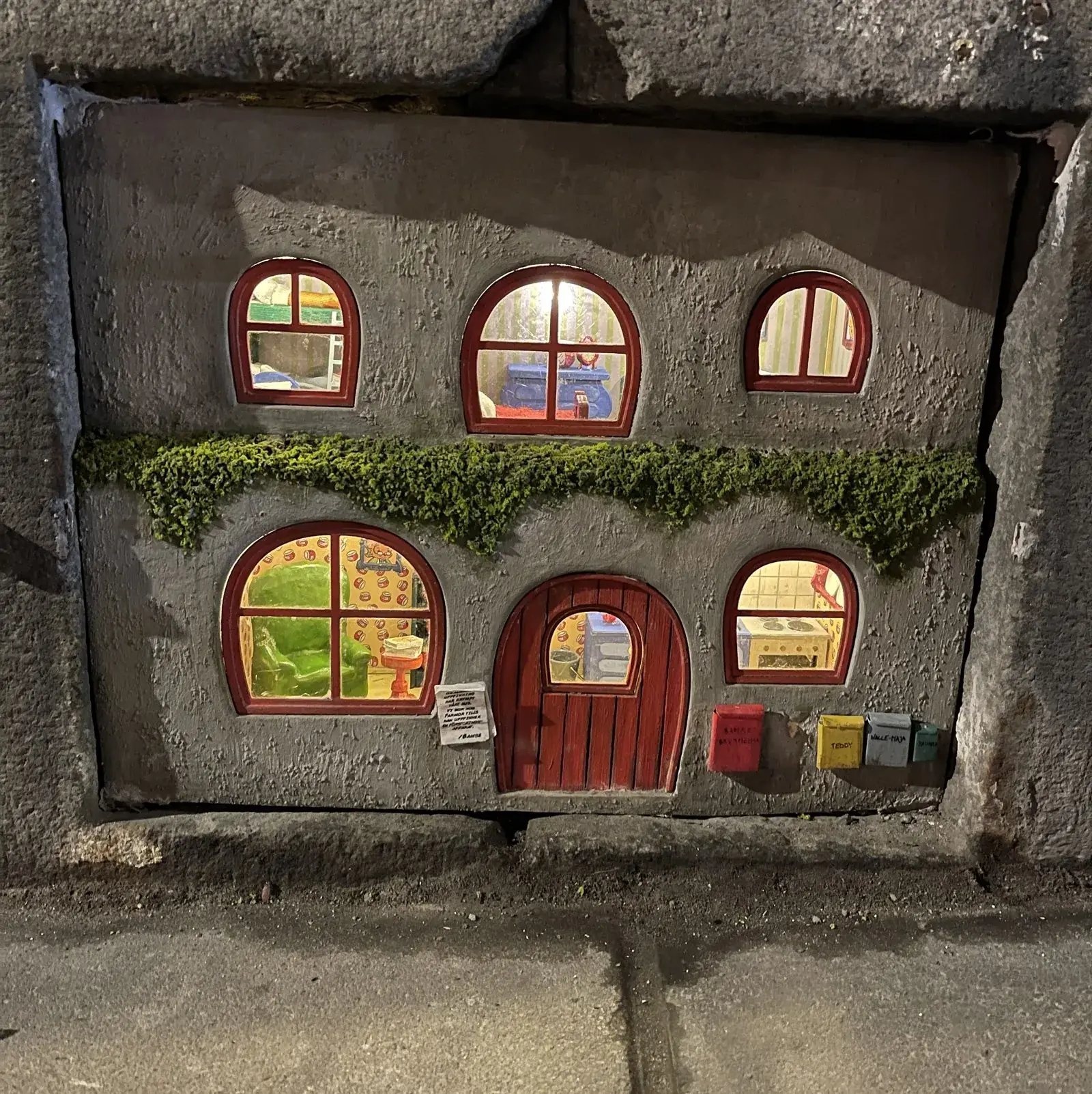 Front view of Bamse's miniature house installed in Södermalm