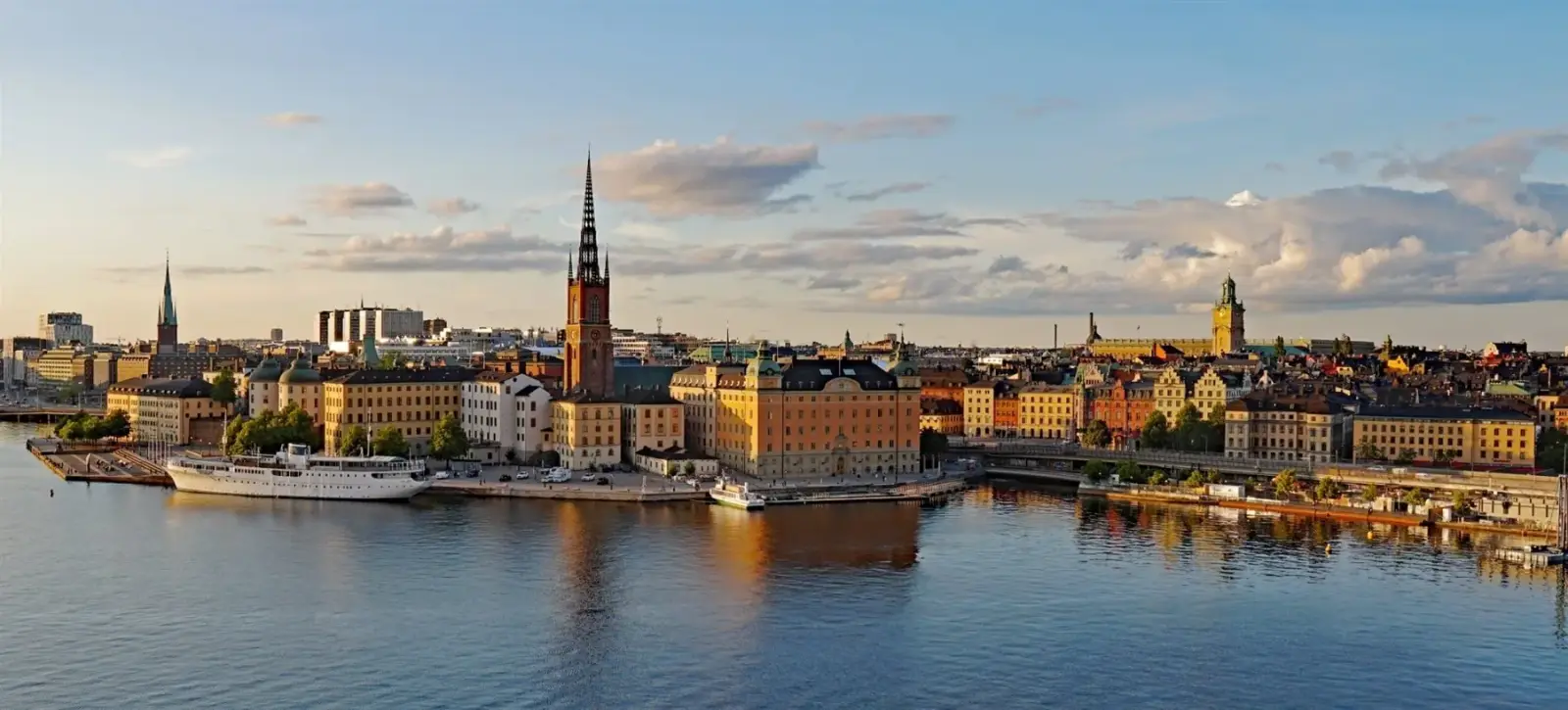 Panoramic skyline view across Stockholm's waterfront at golden hour