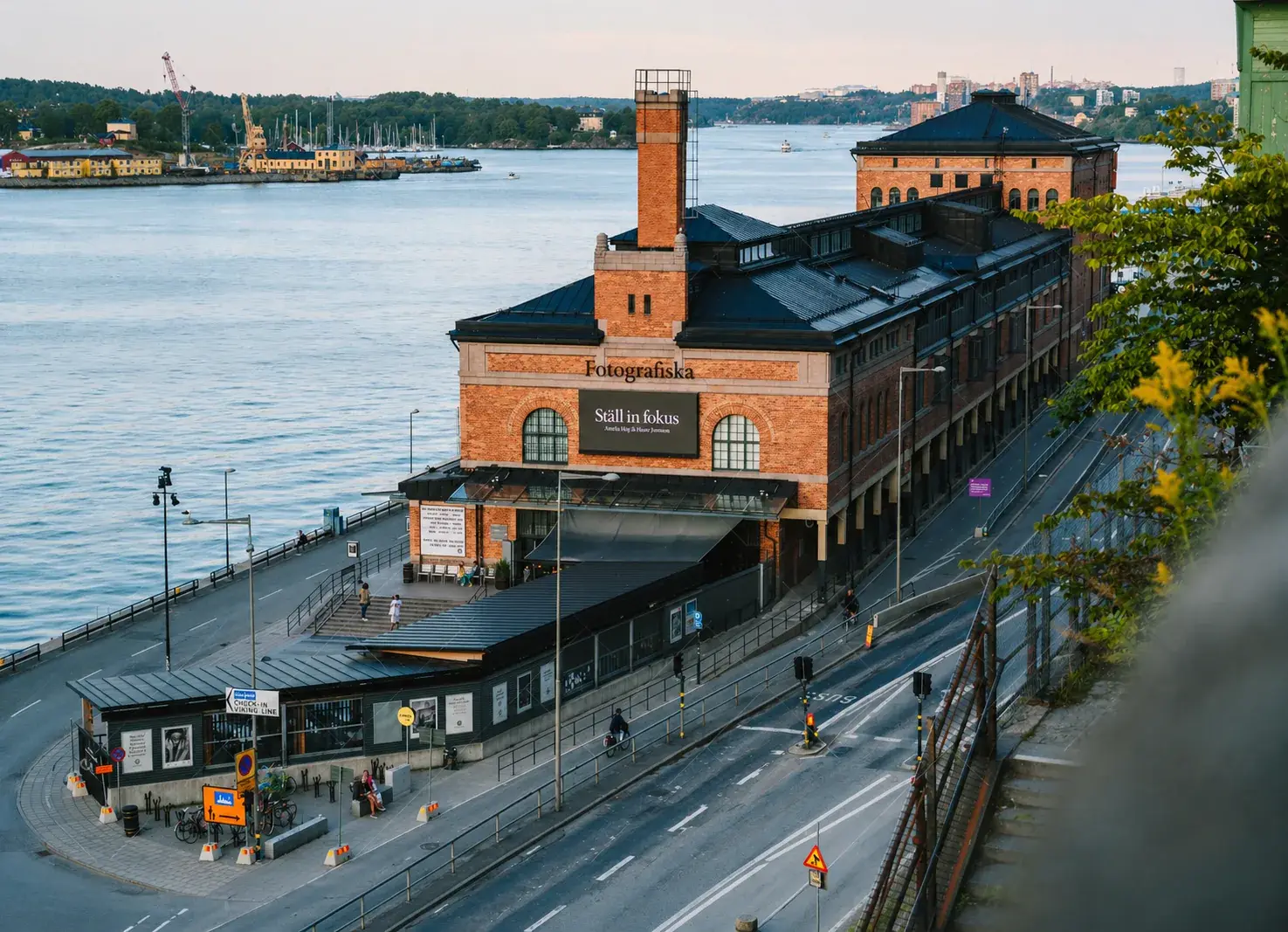 Exterior view of Fotografiska's brick waterfront building at Stadsgardshamnen in Stockholm