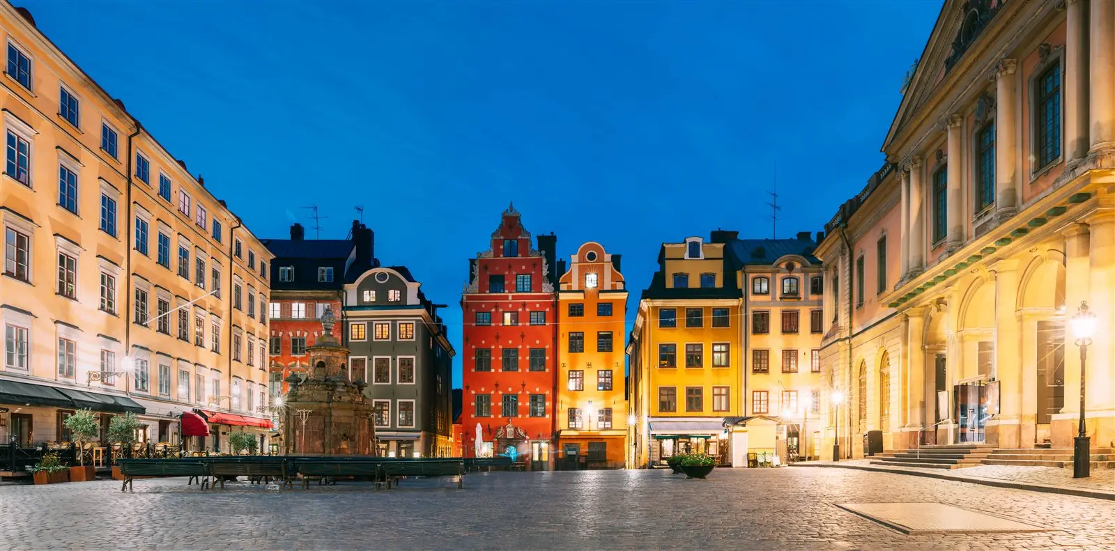 Stortorget square in Gamla stan at night with colorful historic buildings and warm lights