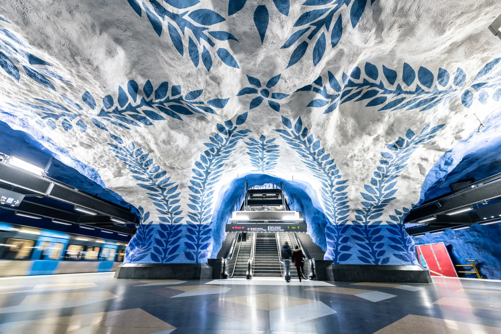 Blue-and-white vine artwork inside Stockholm's T-Centralen subway station