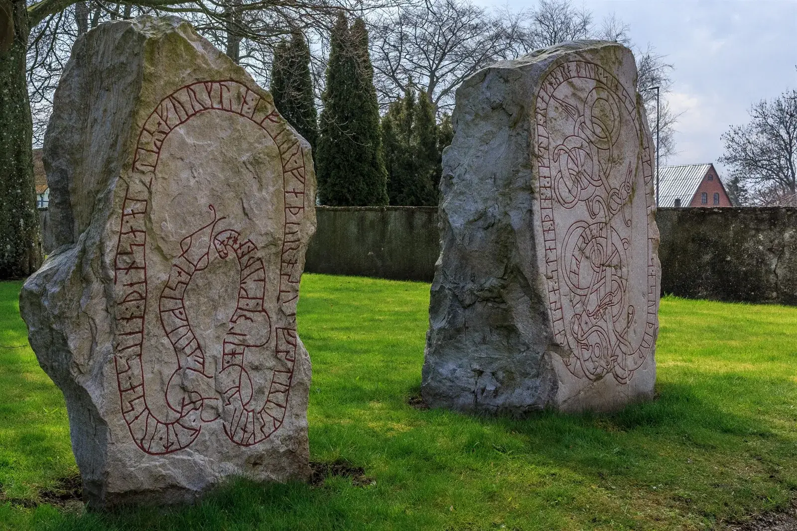 Runestones standing on grass in daylight